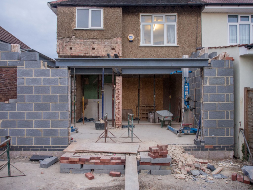 UK home rear extension under construction with blockwork and steel RSJ beam by Ikveles Construction